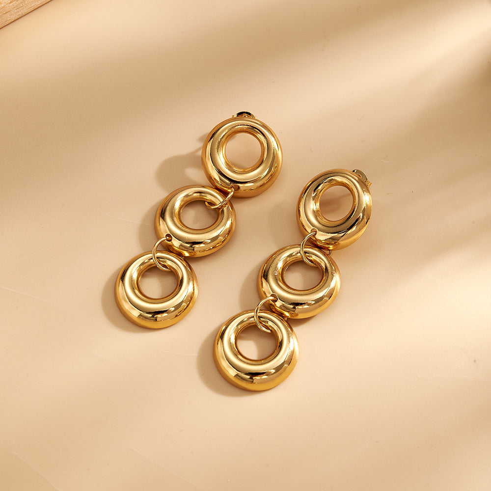 Aretes largos de diseño circular con baño de oro
