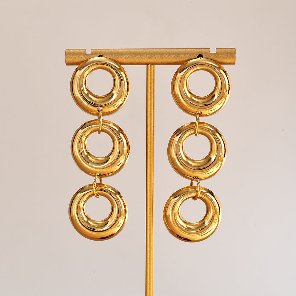 Aretes largos de diseño circular con baño de oro